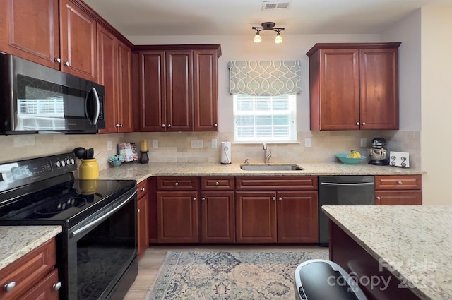 5748 Timbertop Ln, Charlotte, NC 28215 - kitchen with black range with electric cooktop, a sink, dishwasher, and decorative backsplash