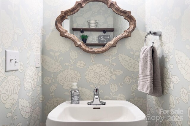 5748 Timbertop Ln, Charlotte, NC 28215 - half bathroom featuring a sink and wallpapered walls