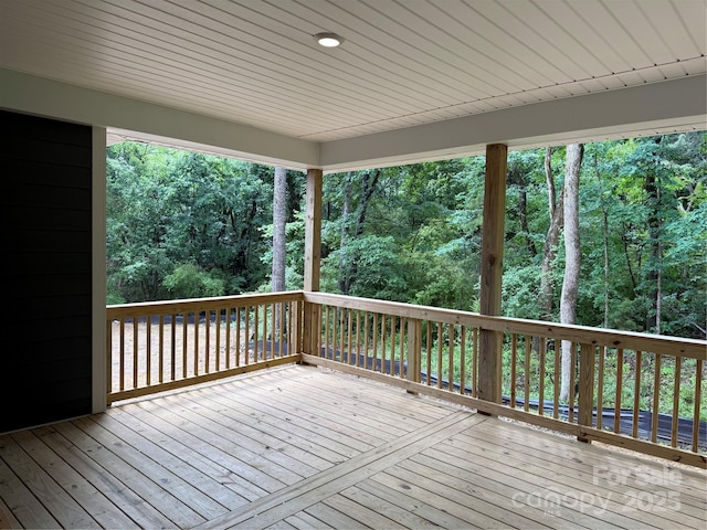 deck with a wooded view