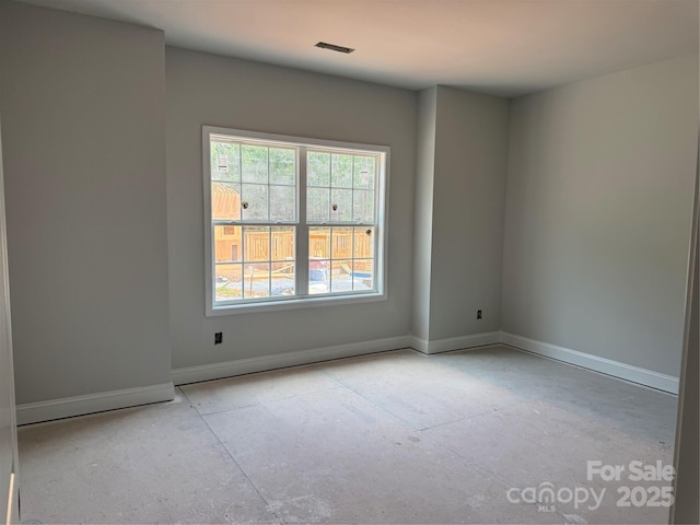 empty room with baseboards