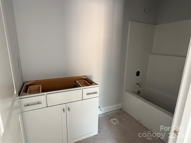 full bathroom with baseboards