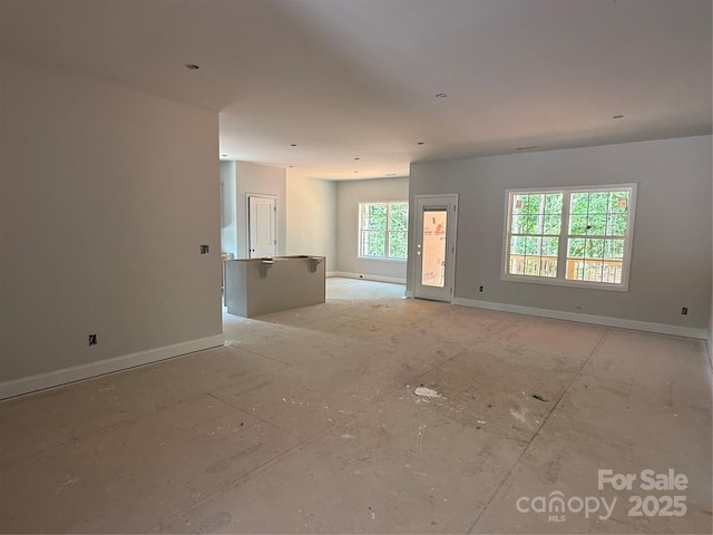 empty room featuring baseboards