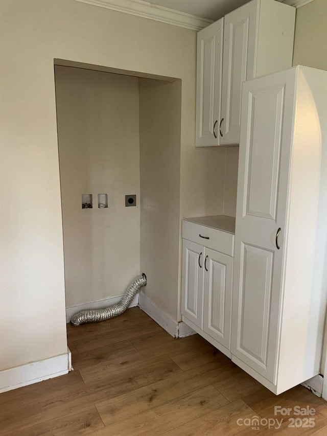 laundry area featuring hookup for an electric dryer, ornamental molding, washer hookup, baseboards, and light wood-style floors