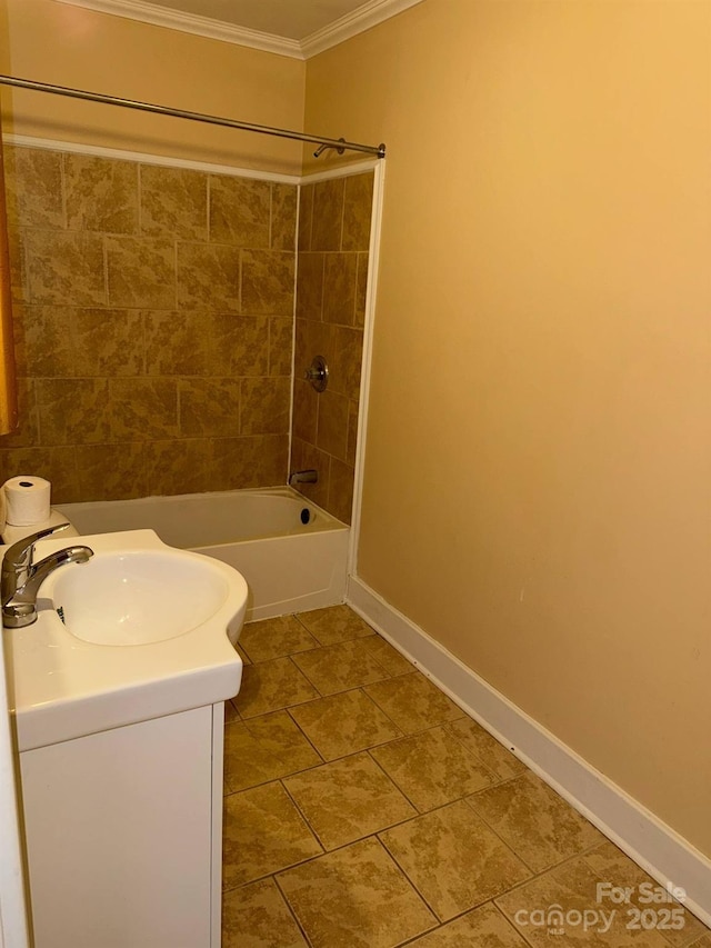 full bath with crown molding, baseboards, bathtub / shower combination, and vanity