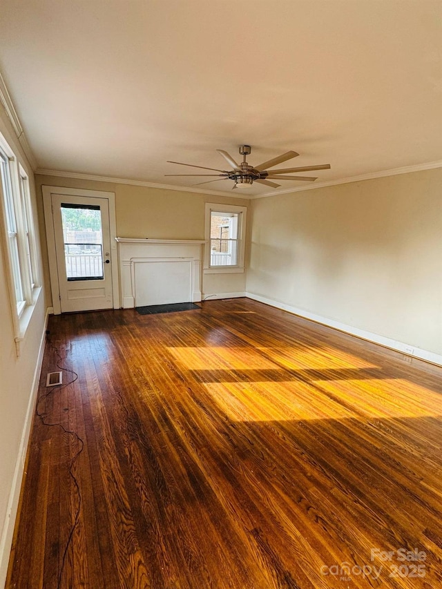 unfurnished living room with hardwood / wood-style flooring, crown molding, ceiling fan, plenty of natural light, and baseboards