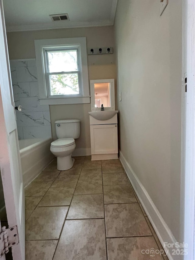 full bath with ornamental molding, vanity, toilet, a tub, and tile patterned floors