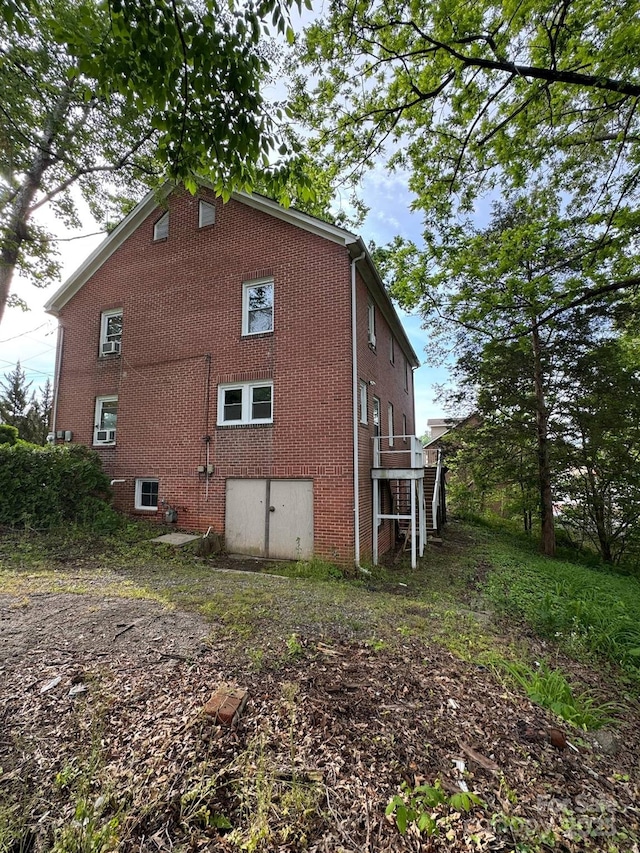 view of home's exterior featuring brick siding