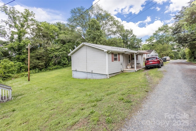 100 Lanier St, Mount Holly, NC 28120 - view of front facade featuring a front lawn, driveway, and covered porch