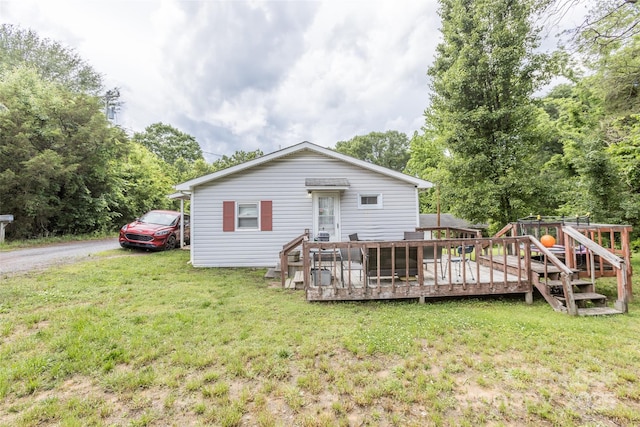100 Lanier St, Mount Holly, NC 28120 - rear view of property with a wooden deck, a yard, and view of scattered trees