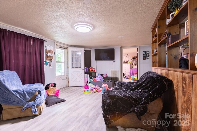 100 Lanier St, Mount Holly, NC 28120 - living area with wood finished floors and a textured ceiling