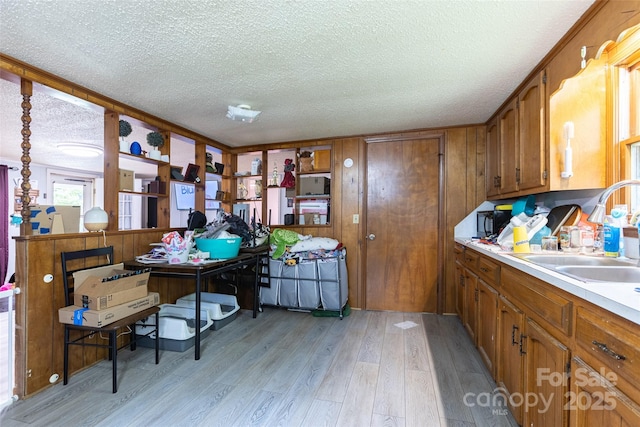 100 Lanier St, Mount Holly, NC 28120 - office with a textured ceiling, light wood-style flooring, and a sink
