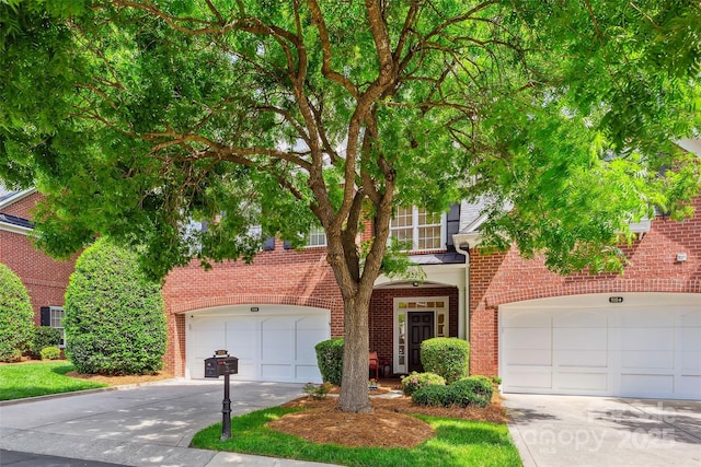 3128 Ethereal Ln, Charlotte, NC 28226 - view of front facade featuring brick siding, concrete driveway, and an attached garage