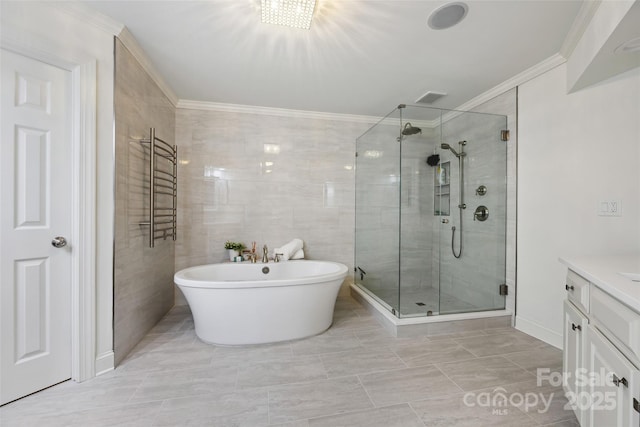 3128 Ethereal Ln, Charlotte, NC 28226 - full bathroom with a stall shower, vanity, crown molding, a freestanding bath, and marble finish flooring