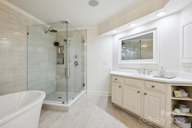 3128 Ethereal Ln, Charlotte, NC 28226 - bathroom with a shower stall, a freestanding bath, crown molding, vanity, and baseboards