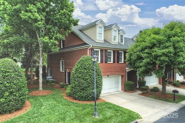 3128 Ethereal Ln, Charlotte, NC 28226 - view of front of property with brick siding, driveway, a garage, a shingled roof, and a front lawn