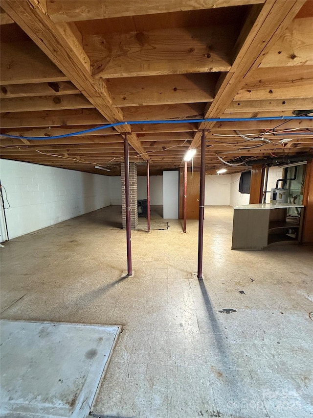 1821 Beaman St, Shelby, NC 28152 - unfinished basement featuring concrete block wall