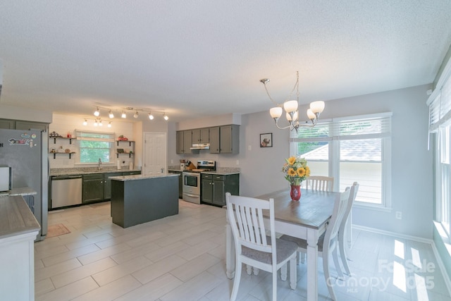 1739 Lesa Lin Dr, Monroe, NC 28112 - dining space with a chandelier and a textured ceiling