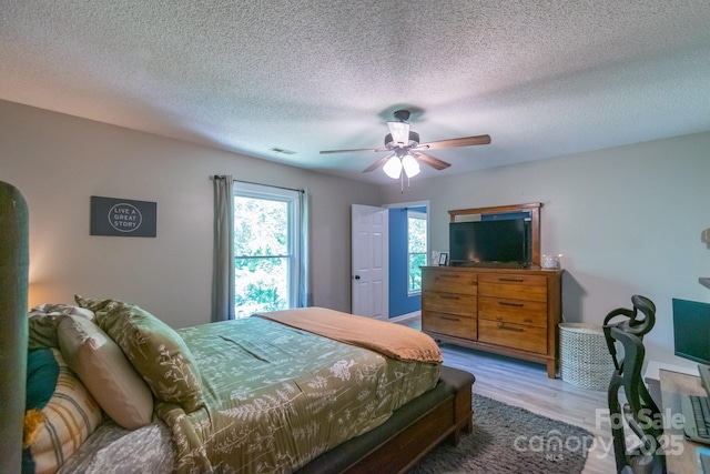 1739 Lesa Lin Dr, Monroe, NC 28112 - bedroom with wood finished floors, a textured ceiling, and a ceiling fan