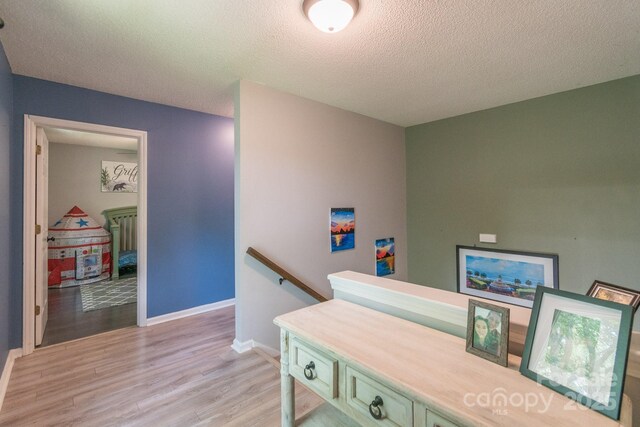1739 Lesa Lin Dr, Monroe, NC 28112 - office with light wood-type flooring, a textured ceiling, and baseboards