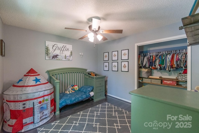 1739 Lesa Lin Dr, Monroe, NC 28112 - bedroom with wood finished floors, a textured ceiling, a ceiling fan, a closet, and baseboards