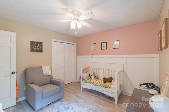 1739 Lesa Lin Dr, Monroe, NC 28112 - bedroom featuring wood finished floors, a closet, a ceiling fan, and a nursery area
