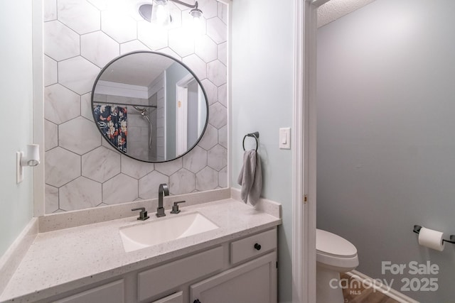 1739 Lesa Lin Dr, Monroe, NC 28112 - bathroom with toilet, vanity, tasteful backsplash, baseboards, and a shower with shower curtain