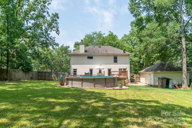 1739 Lesa Lin Dr, Monroe, NC 28112 - rear view of house featuring a chimney and a deck
