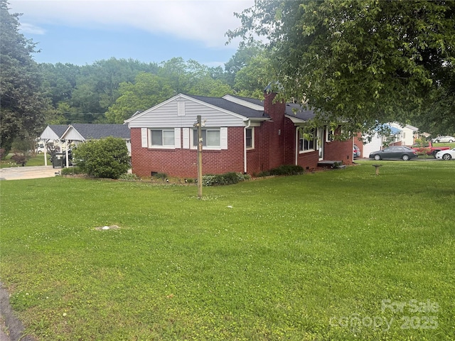 2601 Marldale St, Gastonia, NC 28052 - view of home's exterior with a lawn, brick siding, and a chimney