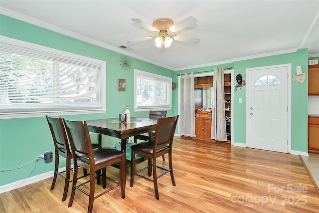 2601 Marldale St, Gastonia, NC 28052 - dining space featuring ornamental molding, a ceiling fan, and light wood-type flooring