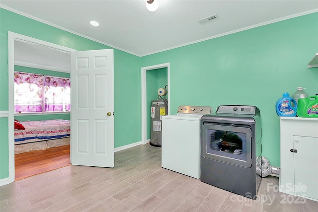 2601 Marldale St, Gastonia, NC 28052 - laundry room with washer and dryer, crown molding, water heater, light wood-style flooring, and cabinet space