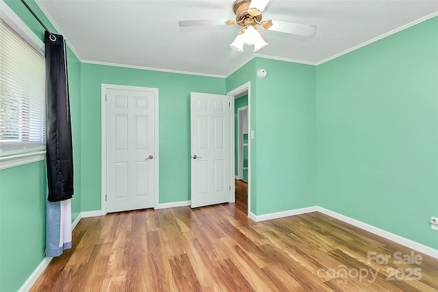2601 Marldale St, Gastonia, NC 28052 - unfurnished bedroom with wood finished floors, crown molding, and a ceiling fan