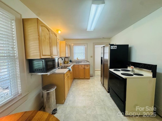 2357 28th St NE, Hickory, NC 28601 - kitchen featuring range with electric stovetop, black microwave, a sink, stainless steel fridge with ice dispenser, and light brown cabinetry