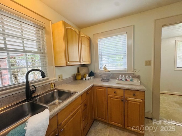 2357 28th St NE, Hickory, NC 28601 - kitchen featuring a sink, light countertops, and light tile patterned flooring