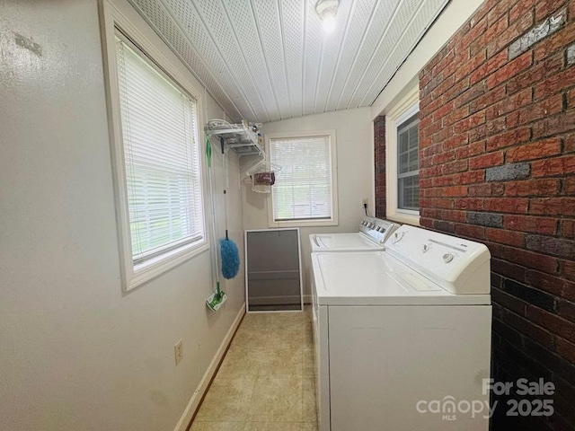 2357 28th St NE, Hickory, NC 28601 - laundry room featuring independent washer and dryer, baseboards, brick wall, and light tile patterned flooring
