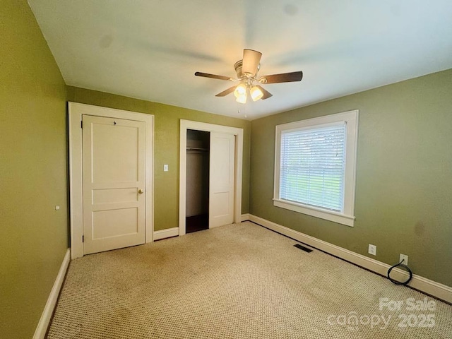 2357 28th St NE, Hickory, NC 28601 - unfurnished bedroom featuring baseboards, carpet floors, a closet, and ceiling fan
