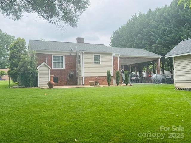 2357 28th St NE, Hickory, NC 28601 - rear view of property featuring brick siding, a chimney, and an attached carport