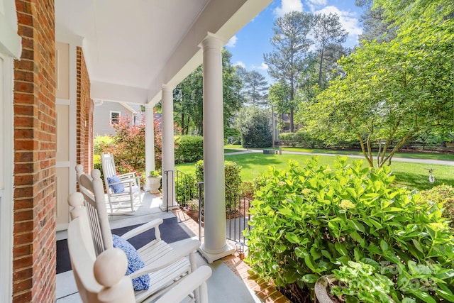 122 Waterford Dr, Mooresville, NC 28117 - covered porch featuring view of wooded area