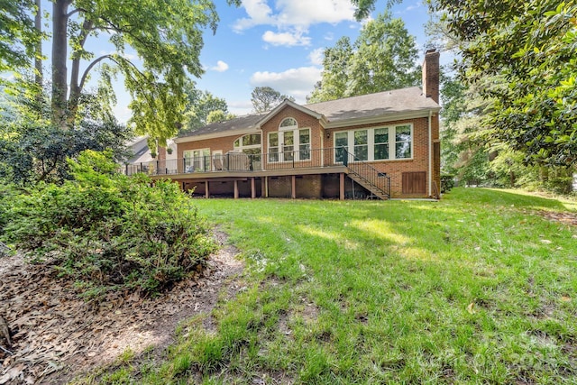 122 Waterford Dr, Mooresville, NC 28117 - back of house featuring stairway, brick siding, a wooden deck, a chimney, and a yard