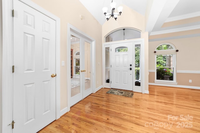 122 Waterford Dr, Mooresville, NC 28117 - foyer with a chandelier, light wood finished floors, baseboards, french doors, and crown molding