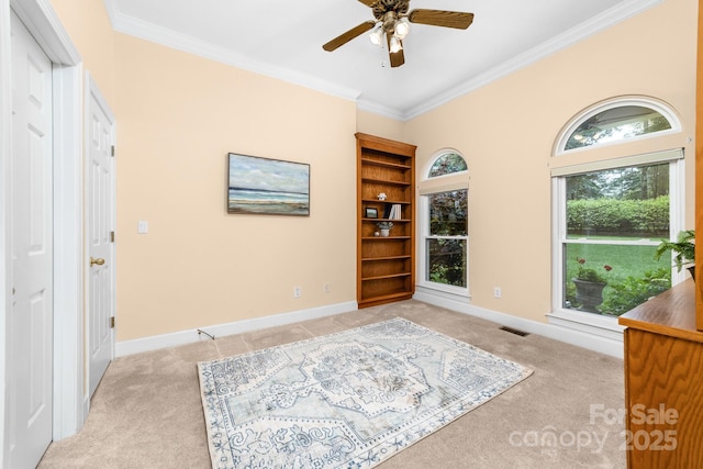 122 Waterford Dr, Mooresville, NC 28117 - foyer featuring light colored carpet, ornamental molding, ceiling fan, and baseboards