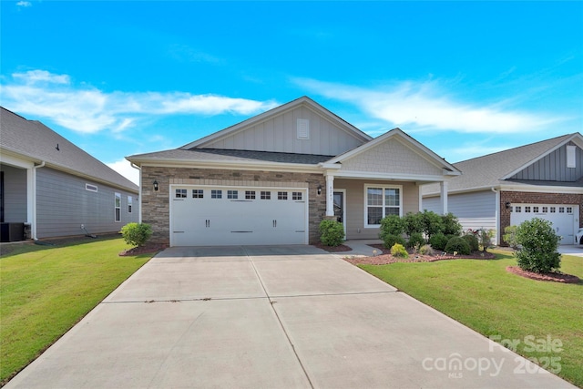 4243 Merrivale Dr, Lancaster, SC 29720 - craftsman-style home featuring board and batten siding, driveway, a front lawn, a garage, and central air condition unit