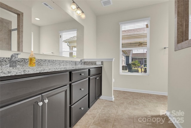 4243 Merrivale Dr, Lancaster, SC 29720 - full bathroom with healthy amount of natural light, double vanity, baseboards, and tile patterned flooring