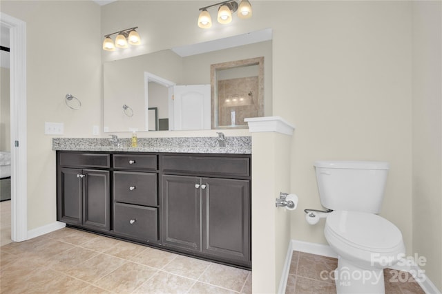 4243 Merrivale Dr, Lancaster, SC 29720 - bathroom featuring toilet, tile patterned floors, baseboards, and double vanity