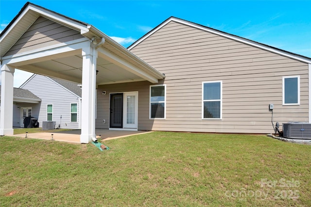 4243 Merrivale Dr, Lancaster, SC 29720 - back of property featuring a patio, a lawn, and central AC unit