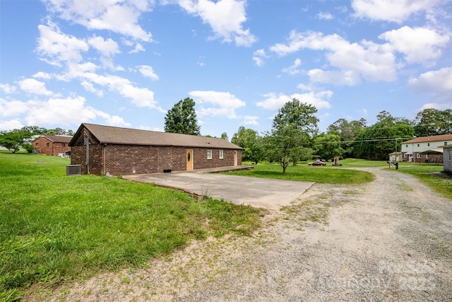 3685 Curleys Fish Camp Rd, Connelly Springs, NC 28612 - view of side of property featuring brick siding, central AC unit, and a yard