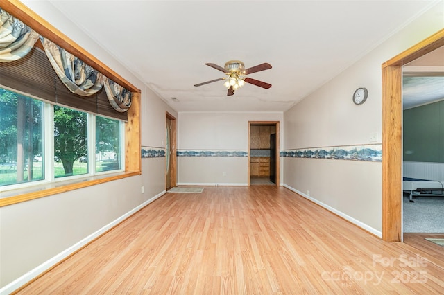 3685 Curleys Fish Camp Rd, Connelly Springs, NC 28612 - empty room with wood finished floors, a ceiling fan, and baseboards