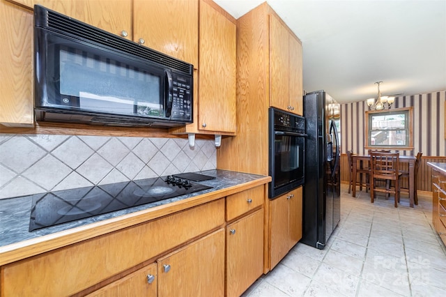 3685 Curleys Fish Camp Rd, Connelly Springs, NC 28612 - kitchen featuring black appliances, a chandelier, decorative backsplash, wallpapered walls, and dark countertops
