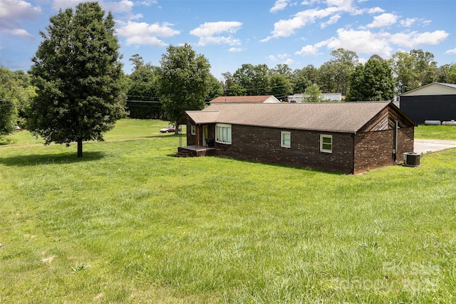 3685 Curleys Fish Camp Rd, Connelly Springs, NC 28612 - view of side of home featuring cooling unit, a lawn, brick siding, and a shingled roof