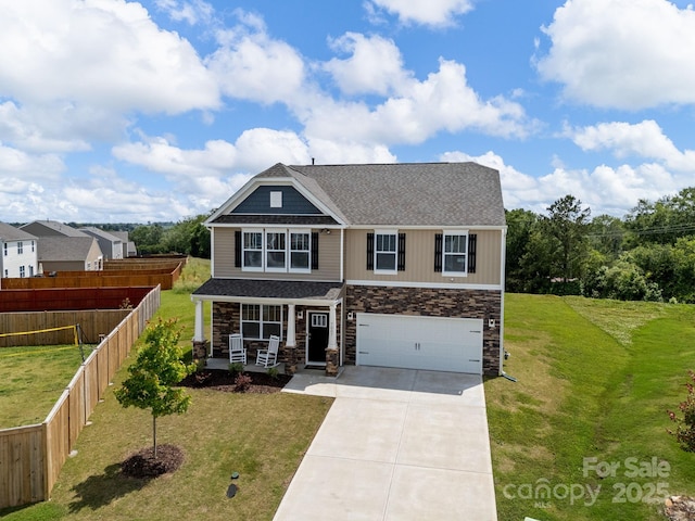 7007 Manse Ct, Boiling Springs, SC 29316 - craftsman house featuring covered porch, concrete driveway, stone siding, and a garage