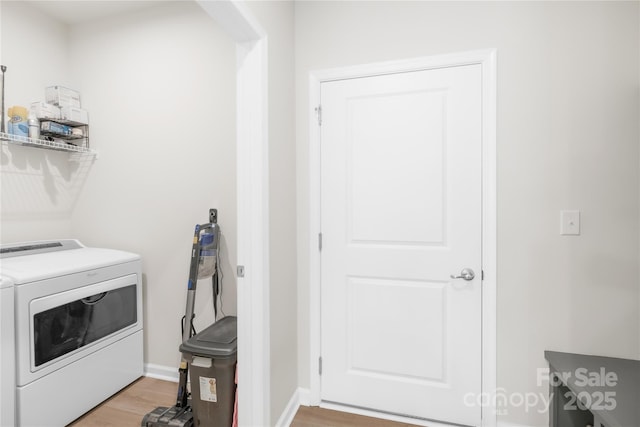 3110 Streamside Dr, Davidson, NC 28036 - washroom with light wood-style flooring, washer and dryer, and baseboards